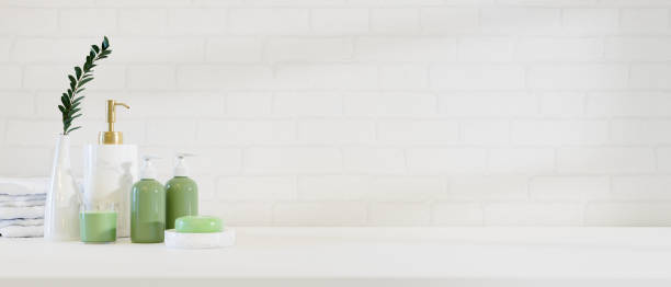 istock Modern stylish bathroom product bottles mockup on white countertop. 1365735788