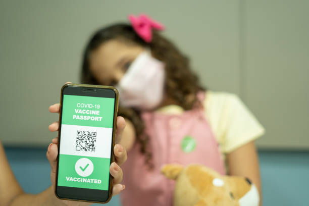 istock Child showing covid passport 1365738769