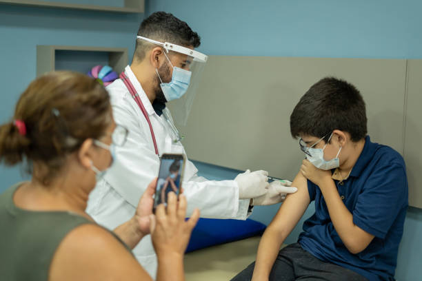 istock Teenager taking selfie while getting covid vaccine 1365738799