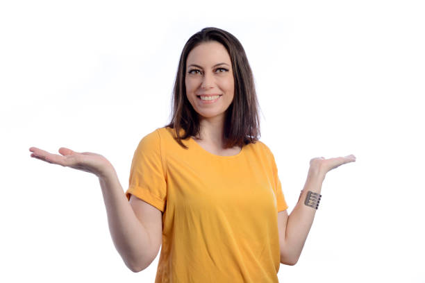 istock Young woman with open arms looking at camera presenting possible product 1365742091
