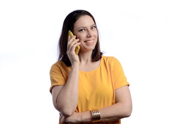 istock Woman talking on cell phone looking at camera 1365742212