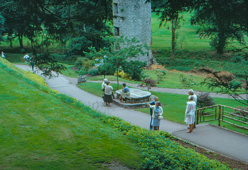 Tourists are visiting Blarney Castle, medieval stronghold, near Cork, Ireland.