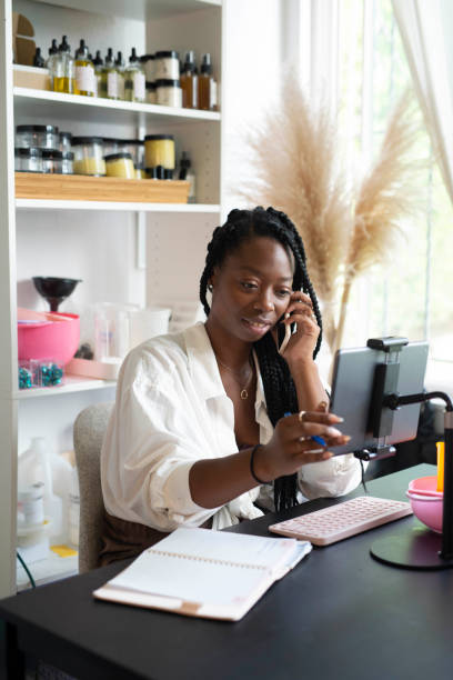 istock African American woman using phone 1365745278