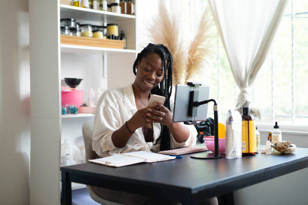 istock African American woman using phone 1365745279