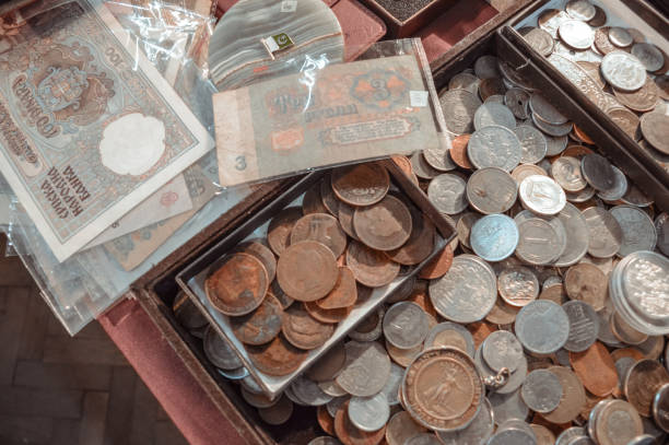 istock Old coins and paper money are on the table. Top view 1365747210