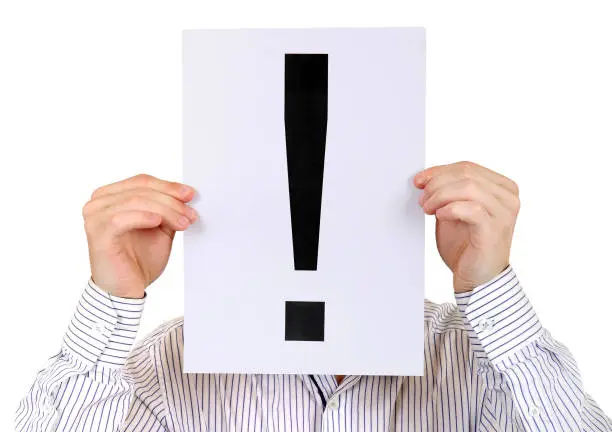 Person hold the Paper with a Exclamation Mark on the White Background