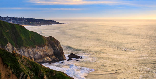 istock Rugged coastal cliffs by the Devil's Slide trail in California at sunset and silky ocean from long exposure 1365755039
