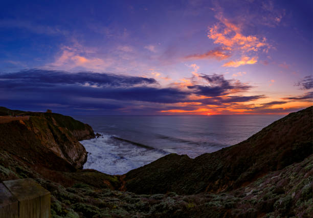 istock Rugged coastal cliffs by the Devil's Slide trail in California at sunset and silky ocean from long exposure 1365755041