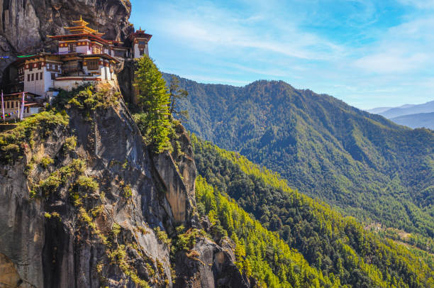 view of the Tiger's Nest monastery also known as the Paro Taktsang and the surrounding area in Bhutan. view of the Tiger's Nest monastery also known as the Paro Taktsang and the surrounding area in Bhutan. Travel and religion concept bhutanese culture photos stock pictures, royalty-free photos & images