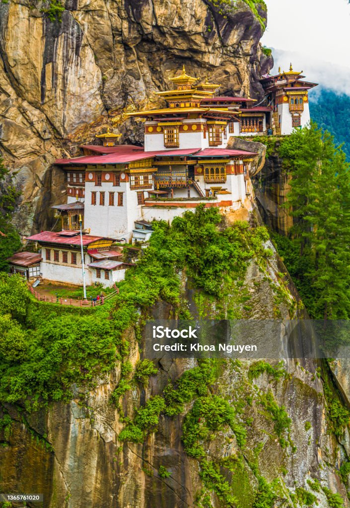 view of the Tiger's Nest monastery also known as the Paro Taktsang and the surrounding area in Bhutan. view of the Tiger's Nest monastery also known as the Paro Taktsang and the surrounding area in Bhutan. Travel and religion concept Bhutan Stock Photo