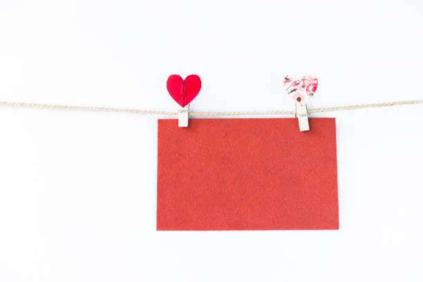 istock Blank red card with heart shape clip on white background 1365765693