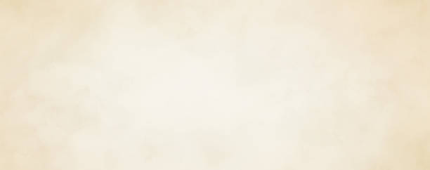 istock light brown rough paper background design with soft white center and grunge textured border, old vintage parchment background design 1365765732