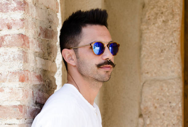 istock Young guy with white shirt and mustache 1365767694
