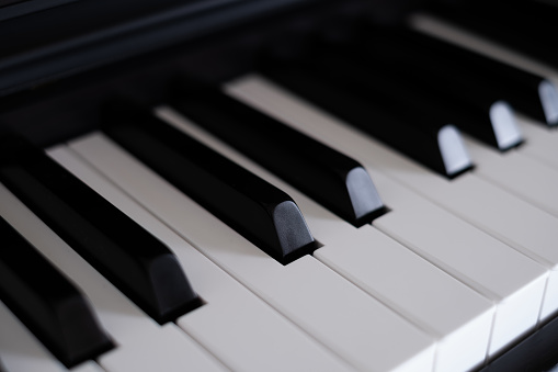 Close-up view of traditional piano keys.