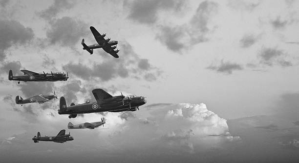 Black and white retro image Battle of Britain WW2 airplanes Black and white retro image of Lancaster bombers from Battle of Britain in World War Two fighter plane photos stock pictures, royalty-free photos & images