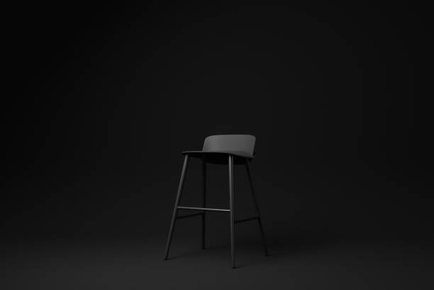 istock Black bar stool on Black background. minimal concept idea. monochrome. render render. 1365783764