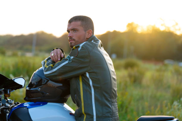 istock Young man on his motorcycle contemplating the landscape calmly 1365788048