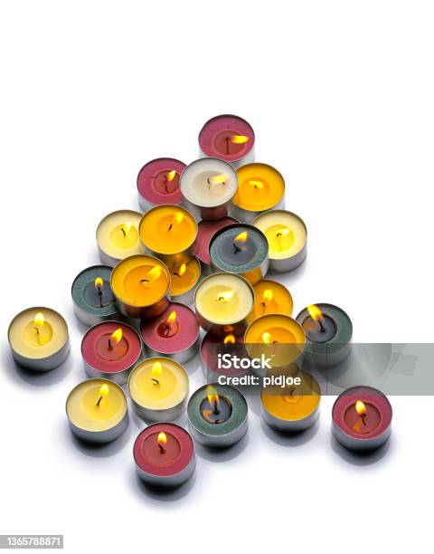Burning Paraffin Candles Tealight On A White Background Stock Photo - Download Image Now