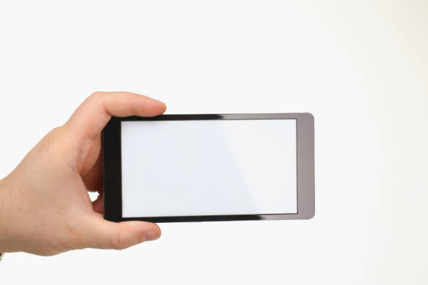 istock Person hold smartphone with white screen on white background 1365789005