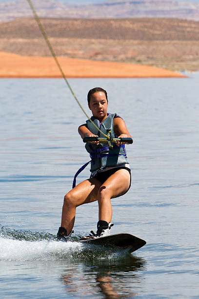 ragazza wakeboarder at lake powell - wakeboarding motorboating extreme sports waterskiing foto e immagini stock