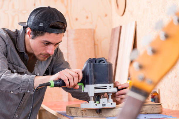 istock Startup, man  Building Guitar in his Workshop 1365791692