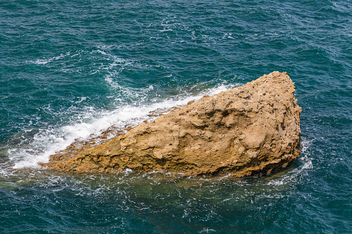 Big rock on the Atlantic Ocean in the bay of Biarritz, France