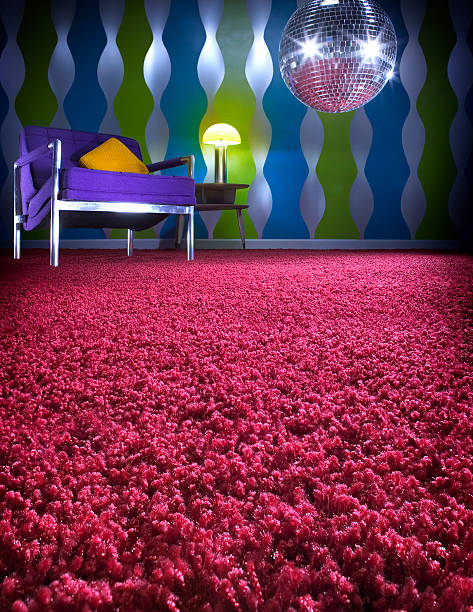 Shag carpet A room scene dominated by the close focus of red shag carpet and accented with a disco mirror ball. shag rug stock pictures, royalty-free photos & images