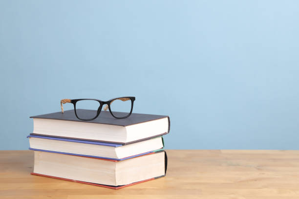 Glasses on Textbook stock photo