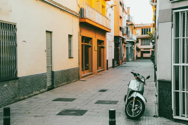 istock Scooter on small spanish street 1365805891