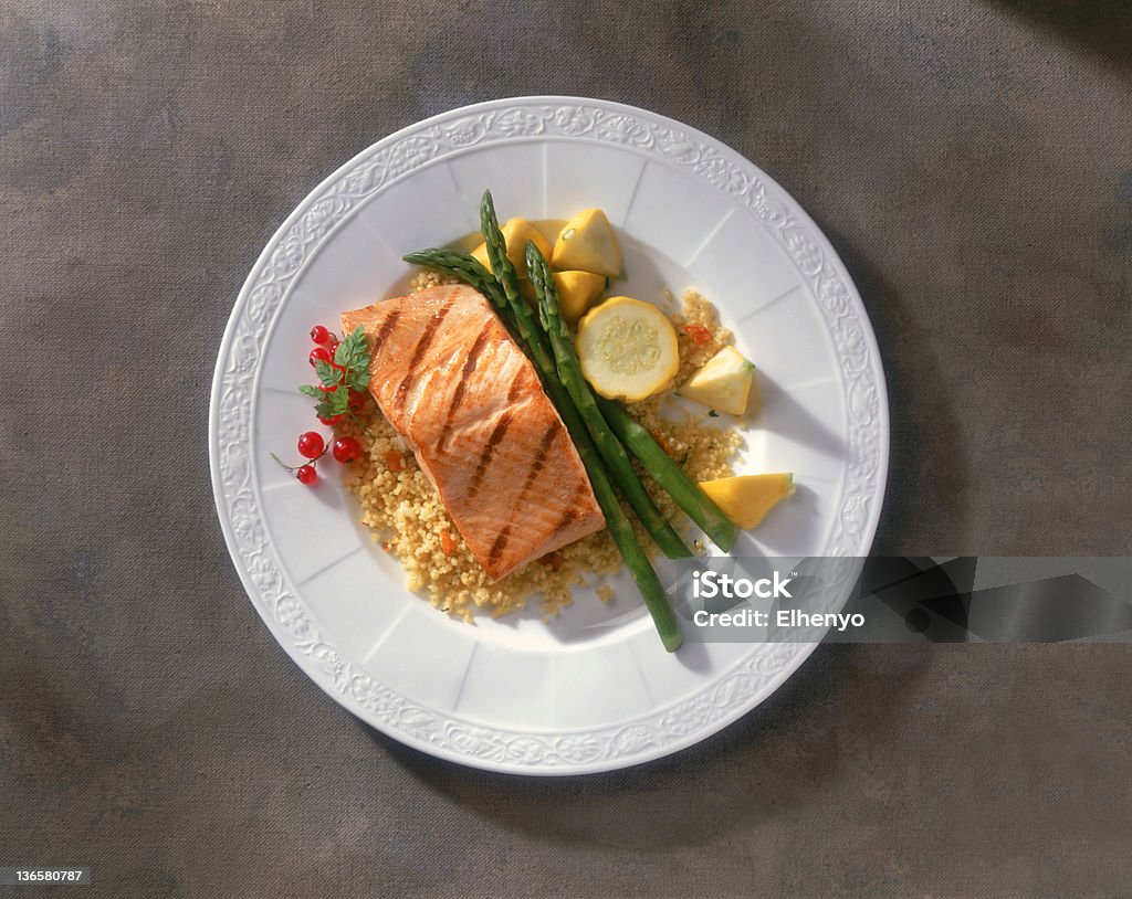 Grilled Salmon A presentation of grilled Salmon with an assortment of sides. Asparagus Stock Photo
