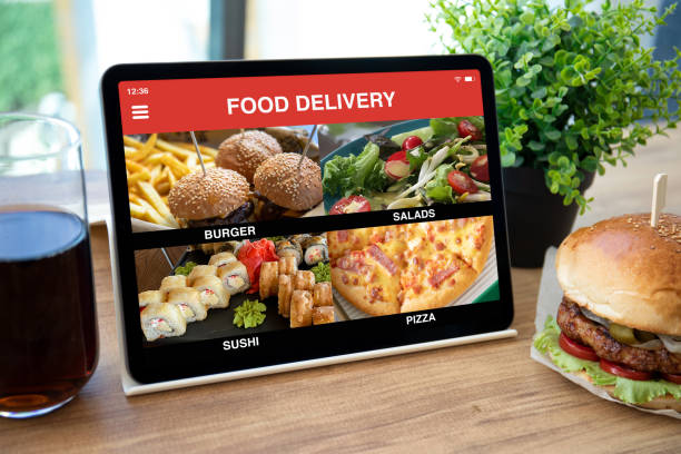 istock computer tablet with app food delivery on screen in cafe 1365808967