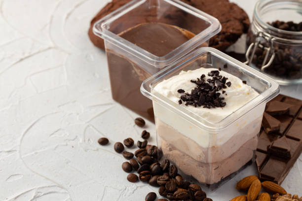 istock Cocoa mousse dessert in plastic transparent box on grey surface 1365809470