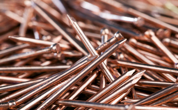 istock nails are covered with a thin layer of copper-colored metal 1365813188