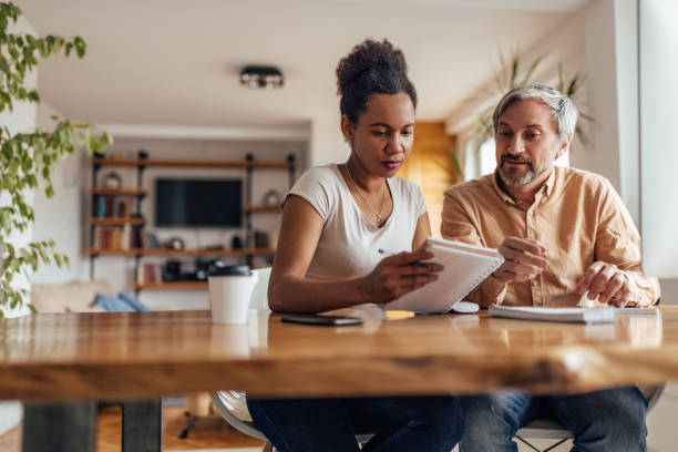 istock Adult couple, arranging their work hours. 1365813937