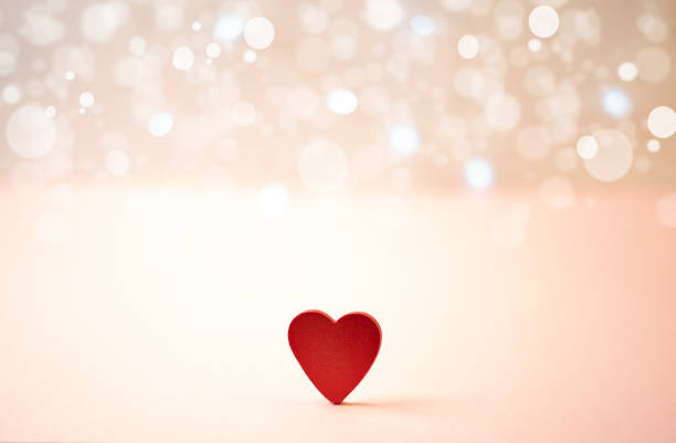 istock Red wooden heart on a bokeh background. 1365815824