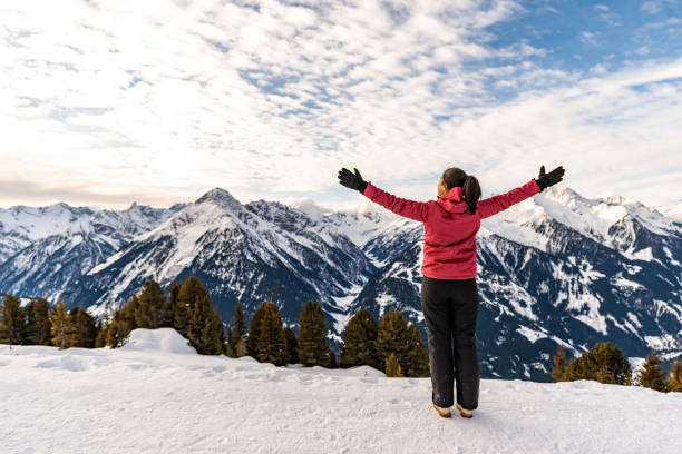 istock Joyful Girl  having fun in winter park while looking at view. 1365817885