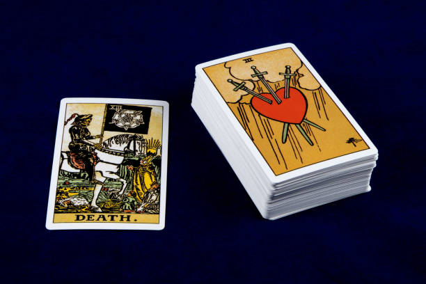 istock Tarot Card with Deck Isolated on a Blue Table Cover 1365818041