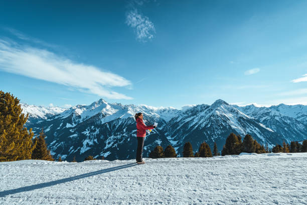 istock Hiker female looking at map for directions 1365822733