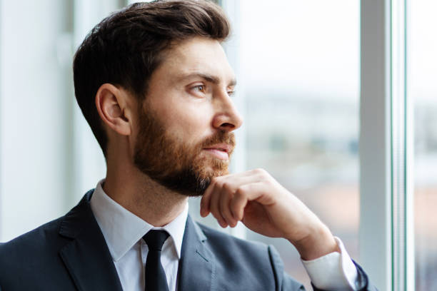 istock Handsome businessman with suit portait 1365822738