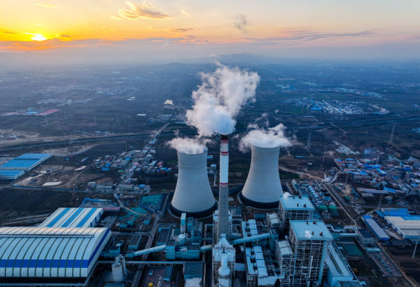 istock Aerial view power station with smoking at sunset 1365823170