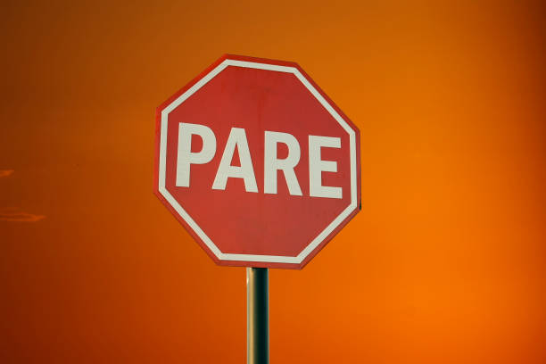 istock mandatory stop sign, in Portuguese PARE 1365825985