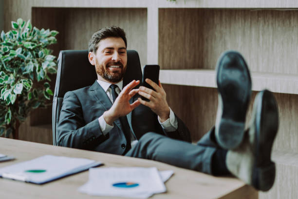 istock Businessman sitting at computer desk in the office 1365826252
