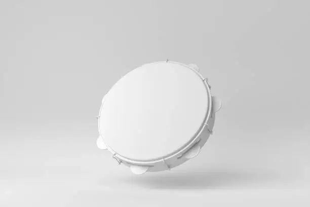 Photo of Wooden tambourine. Musical instrument on white background. Paper minimal concept. 3D render.