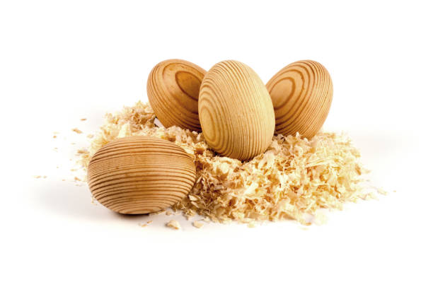 easter eggs from wood and wood shavings as a nest - crafts - wood eggs easter easter egg imagens e fotografias de stock