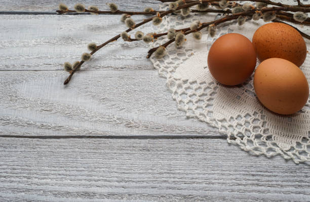 istock Easter eggs with willow branches on wooden background. Easter Nature concept. Minimal concept.  Retro, vintage. Copyspace for text. 1365835207