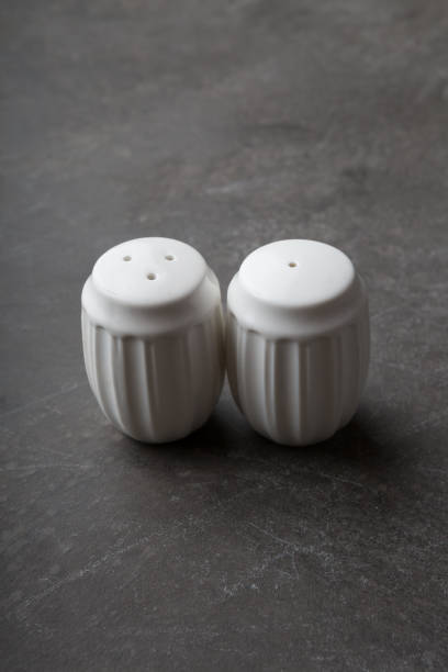istock Salt and pepper shakers served on a black background 1365837138