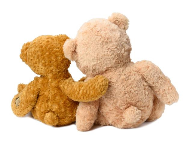 istock two teddy bears sit with their backs on a white isolated background. Love and friendship 1365841480