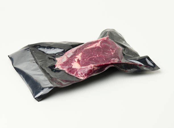 istock piece of fresh beef meat packed in a vacuum plastic bag, top view 1365842716