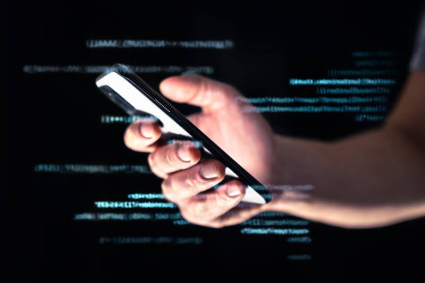istock Phone scam, hack or fraud. Data hacker online with smartphone. Cell cyber scammer on darknet or internet. Phishing or cybersecurity threat with tech and web. Digital code technology. 1365843283