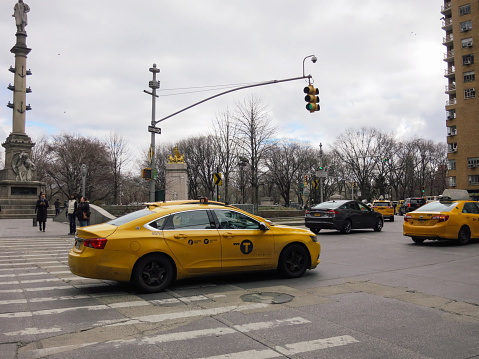 New York, USA - 03 25 2018: Central Manhattan with yellow taxi cabs.
